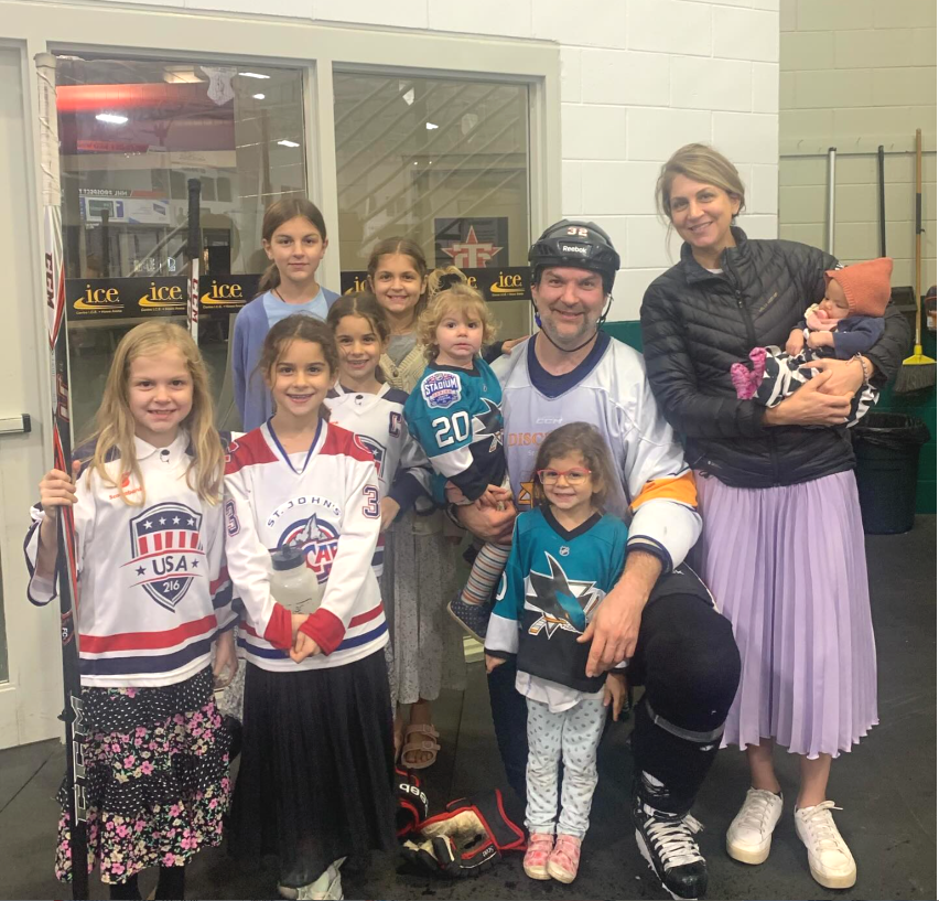John Scott and his family together at the ice rink