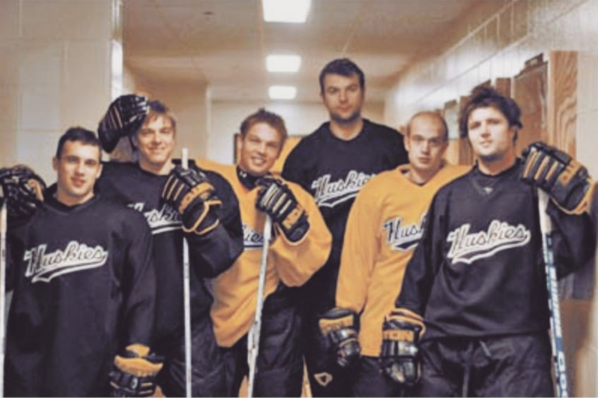 John Scott with his Michigan Tech Huskies teammates